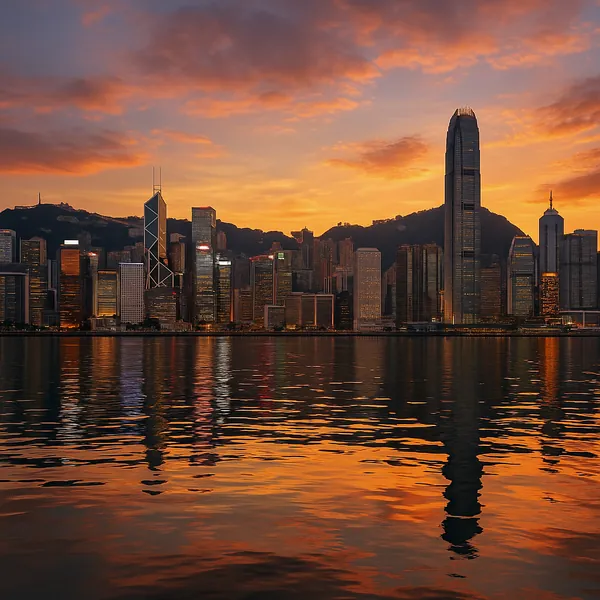 Discover a puzzle with a glowing city skyline at sunset, where glass skyscrapers stand tall against a warm, orange-and-gold sky.