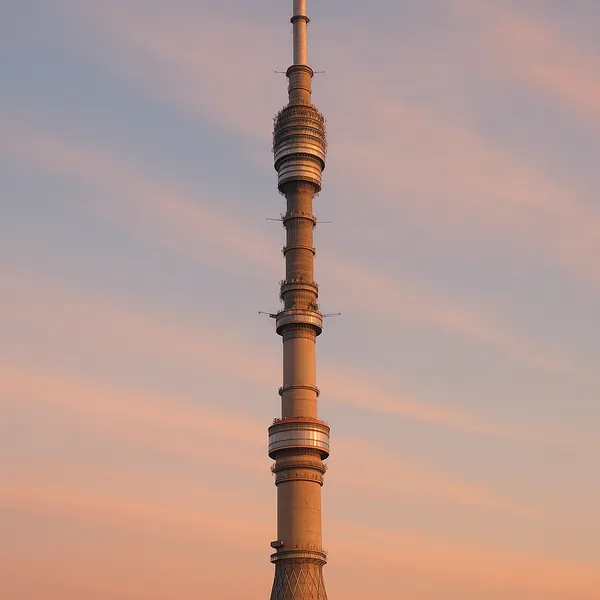 Discover a puzzle with a tall observation tower standing against a pastel sunset sky.