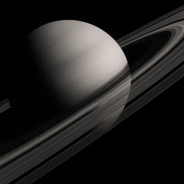 Discover a puzzle with a striking view of a ringed planet against deep black space, rendered in soft monochrome tones.