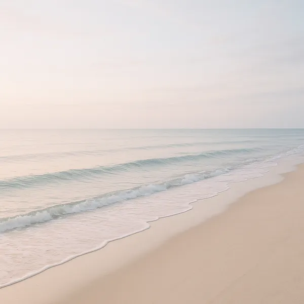Enjoy an online jigsaw puzzle designed for browser play, featuring a serene seaside scene of soft sand meeting gentle waves.
