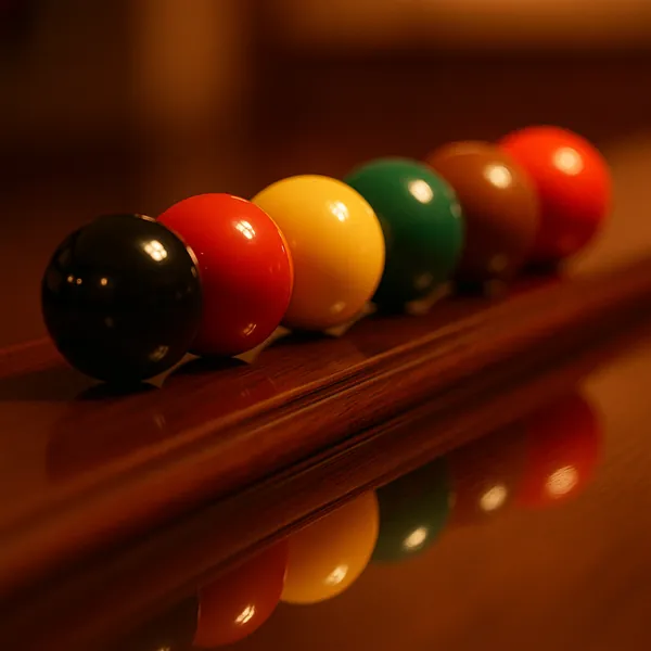 Enjoy an online jigsaw puzzle designed for browser play, featuring a close-up of colorful billiard balls lined up on a polished wooden rail — a charming game- a