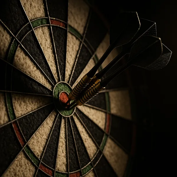 Play an online jigsaw puzzle in your browser that features a close-up of a dartboard and three darts stuck cleanly in the bullseye, perfect for fans of games an
