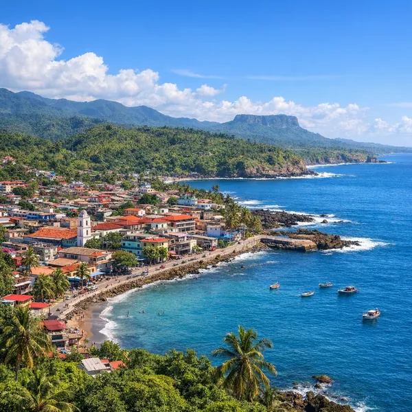 Enjoy an online jigsaw puzzle designed for browser play, featuring a sunlit coastal town where colorful rooftops meet sparkling blue sea and lush green hills.