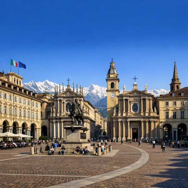 Enjoy an online jigsaw puzzle designed for browser play, featuring a charming city square with historic architecture and distant snow‑capped mountains.